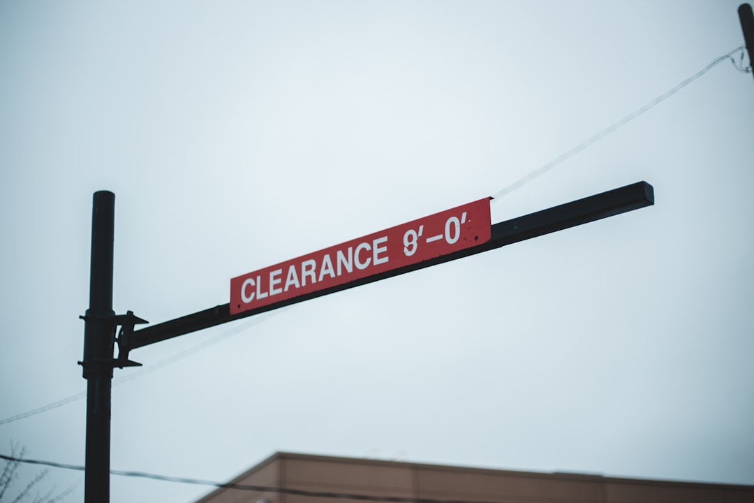 A close-up, minimalist photo of two price tags on similar products, one showing a high price and the other a lower price, highlighting consumer choice.